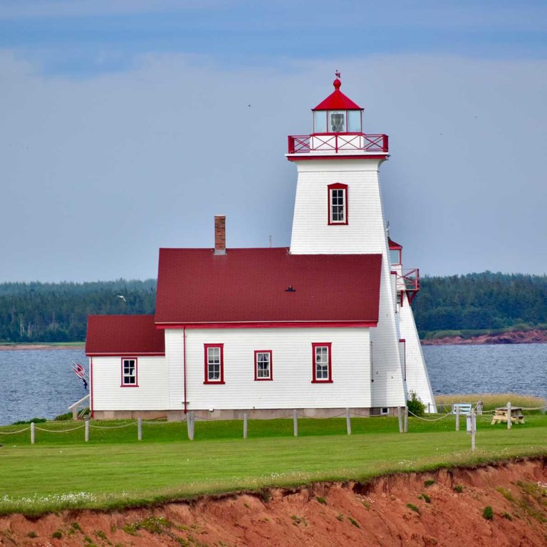 a beautiful old lighthouse in prince edward island Borders Immigration Law Firm